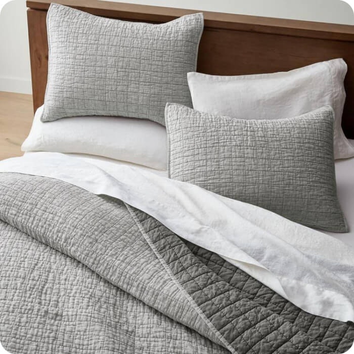 Gray quilted bedding set and pillow shams, from Zola's wedding registry