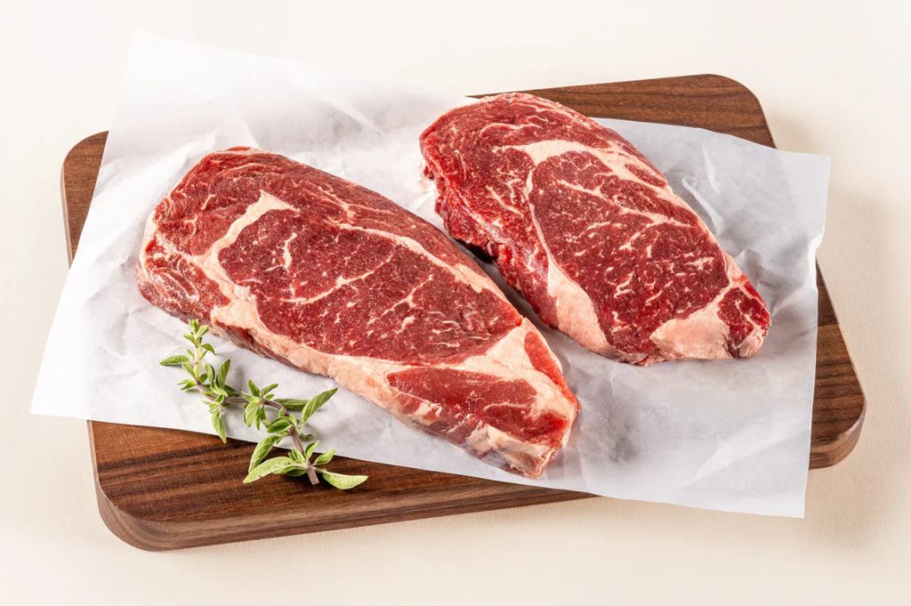 ButcherBox ribeye steaks on a cutting board