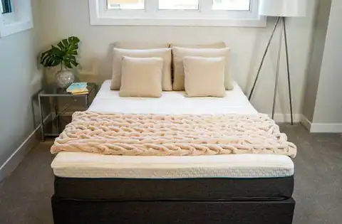 Gotta Sleep mattress on a bed in a bedroom setting, product photography from the Gotta Sleep website