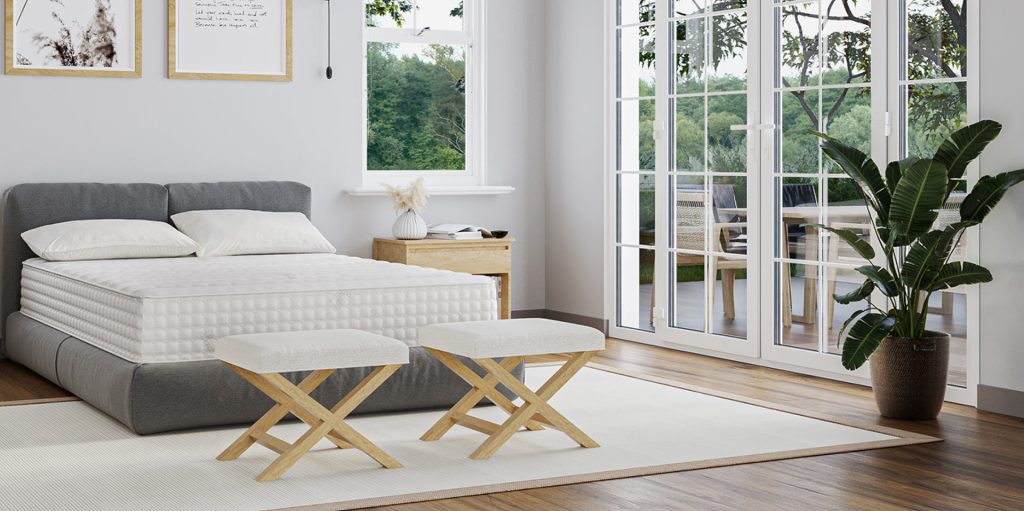 Latex For Less mattress on a bed in a bedroom setting