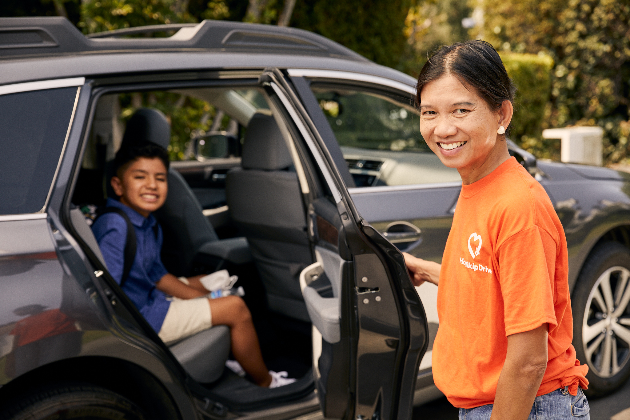 HopSkipDrive driver and student getting into vehicle