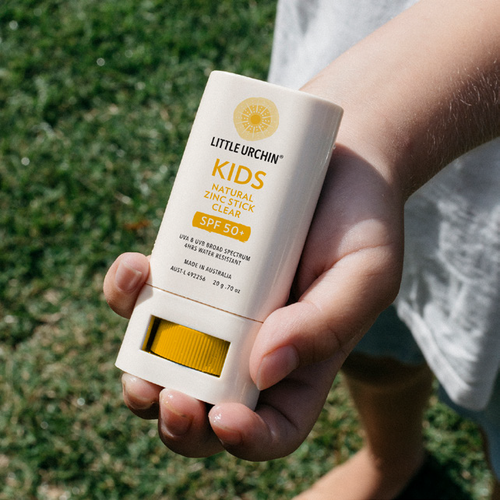 Child holding a Little Urchin natural zinc sunscreen stick, from the Little Urchin website