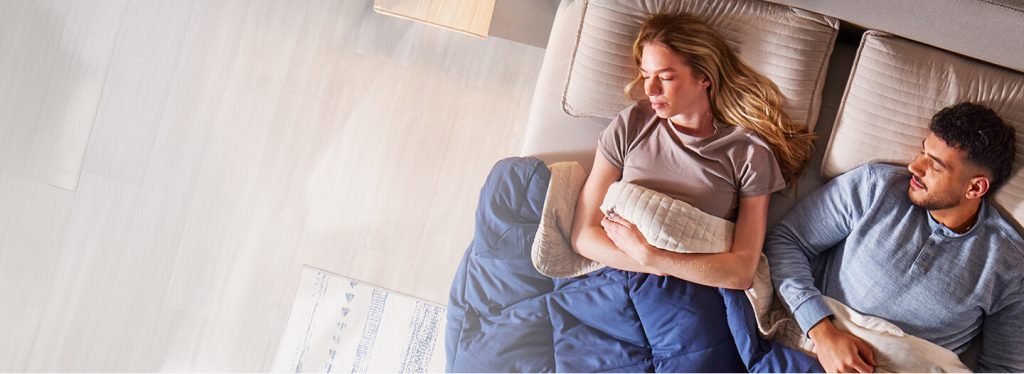 Couple relaxing on a bed, Mattress Firm homepage lifestyle photo
