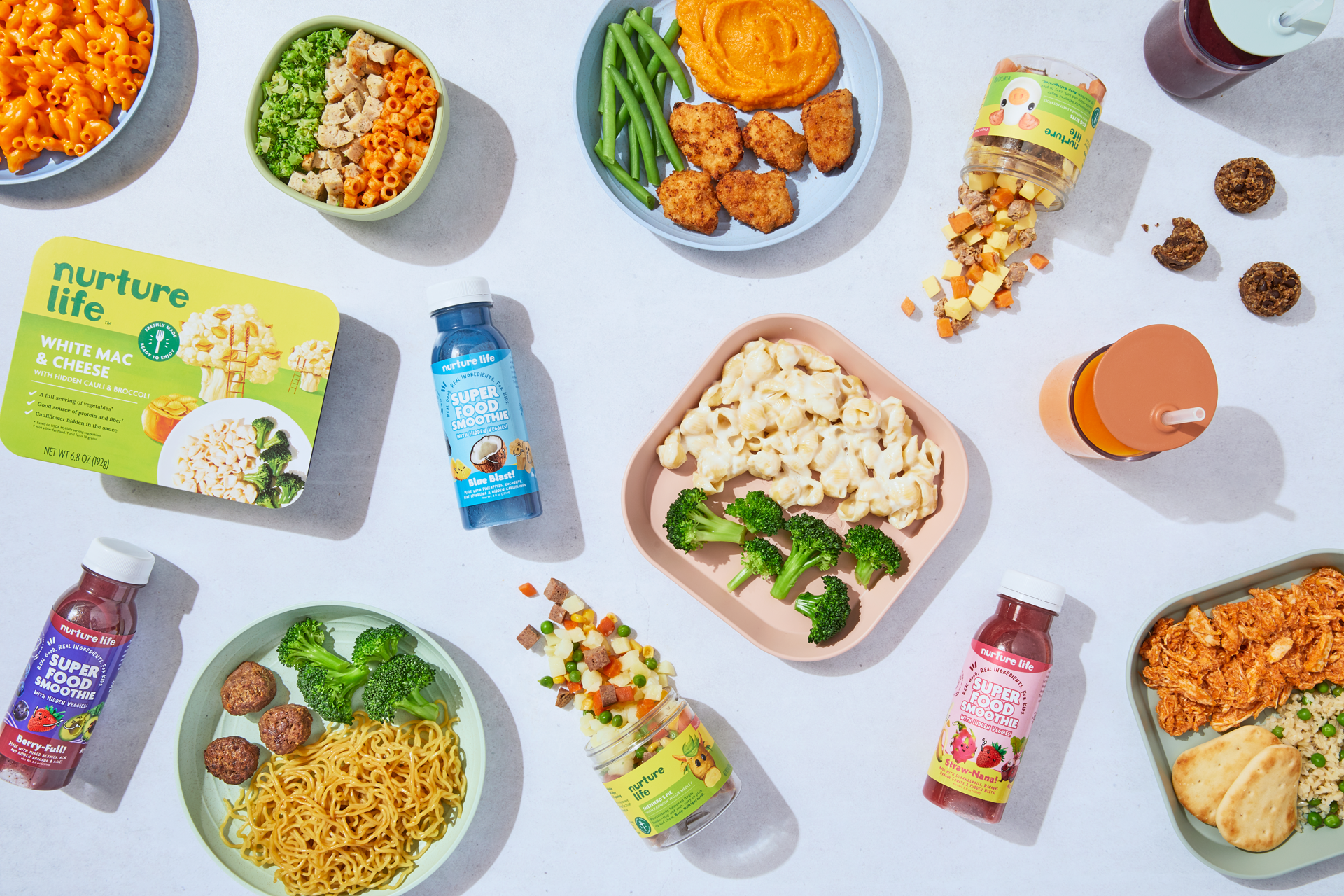 Spread of Nurture Life kids meals, smoothies, and snacks, product photography from the Nurture Life website