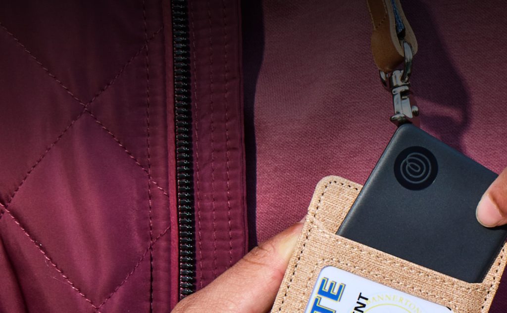 Tile Bluetooth tracker slid into a wallet card slot