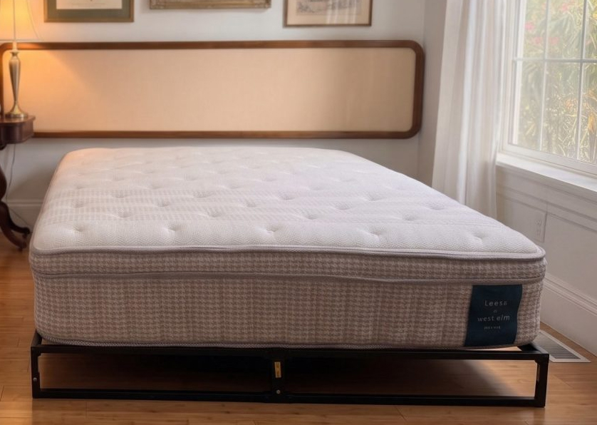 The Leesa Reserve queen mattress on a platform frame, showing the full 13-inch profile and the Leesa + west elm label